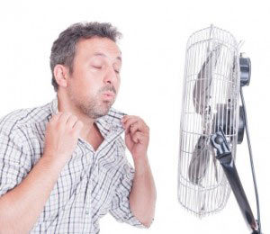 man in front of fan